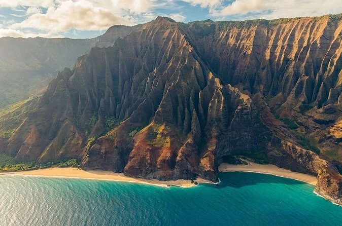Na Pali Coast cliffs and a beach seen from the air